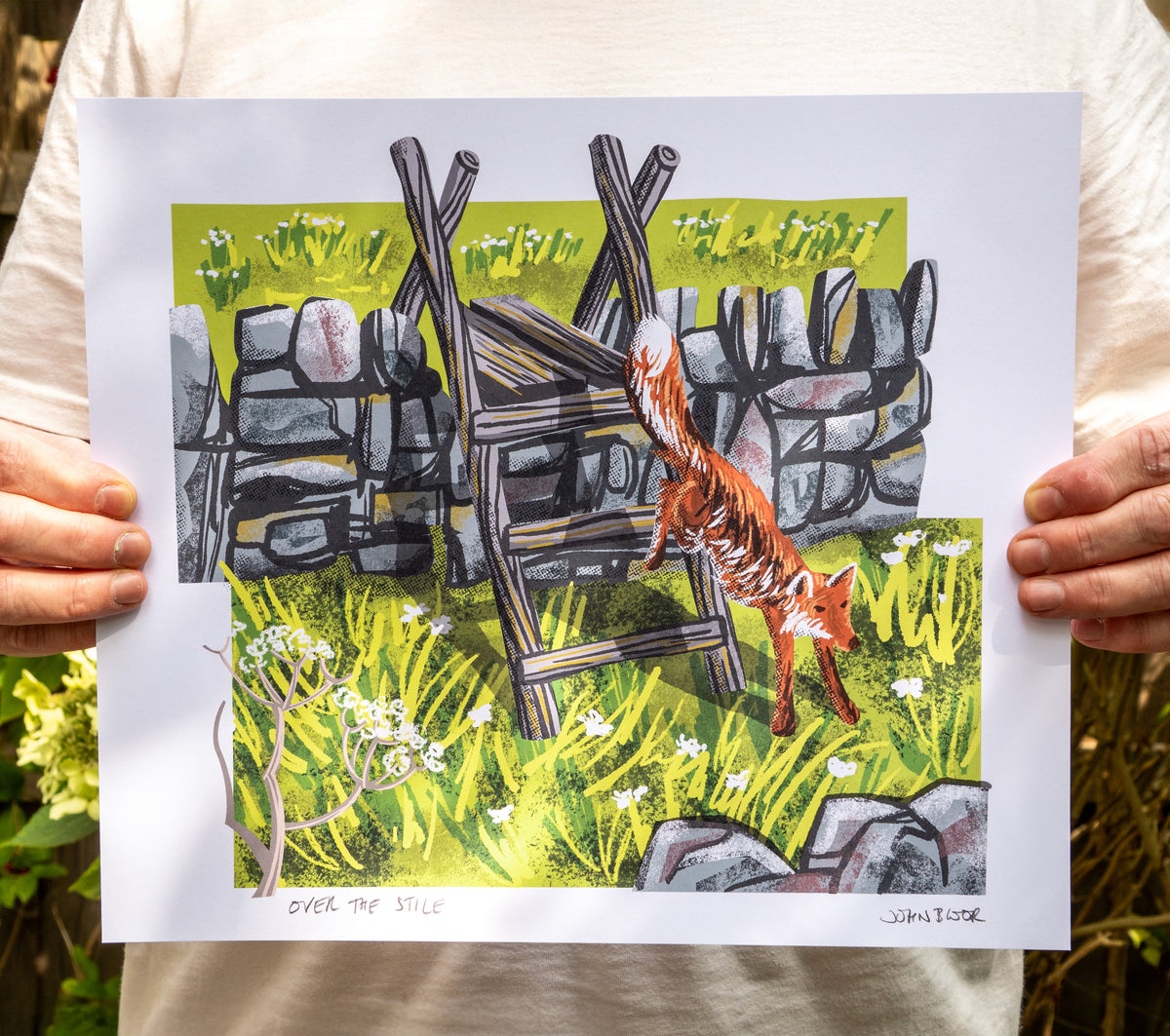 A digital print called Over the Stile, featuring a dry stone wall across a field, with a wooden ladder stile. A fox is jumping down from the stile.