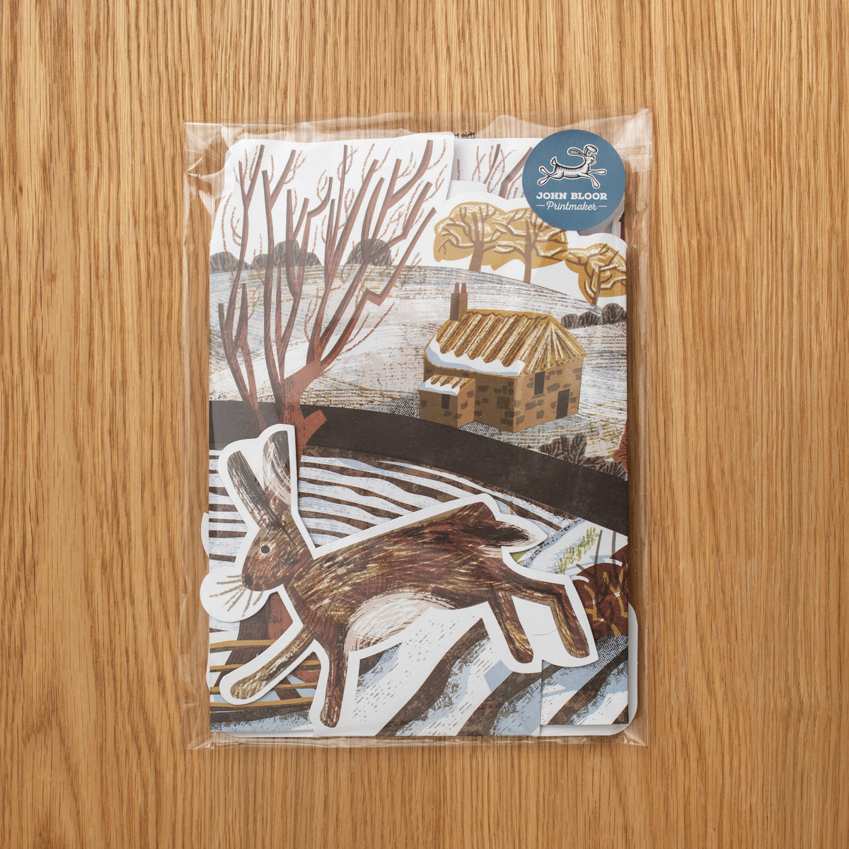 A stand up WInter scene shown in its biodegradable cellophane packaging.