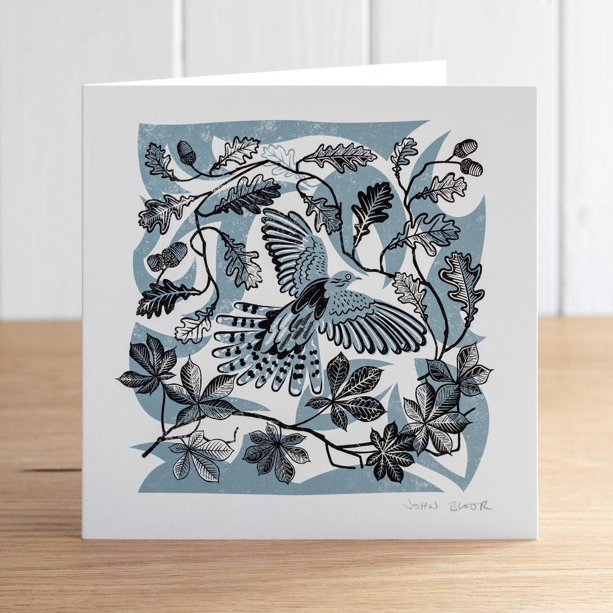 Take Flight Cuckoo greetings card. This card depicts a Cuckoo taking flight amongst oak and horse chestnut leaves.