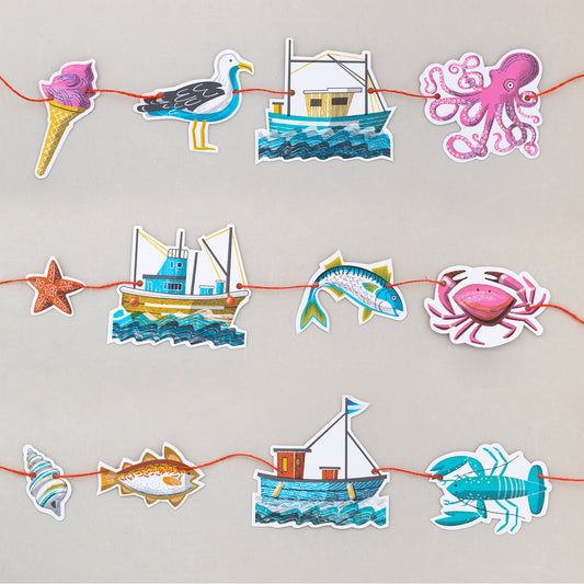 This colourful coastal garland is made of twelve elements including three boats, an ice cream, seagull, octopus, shell, two fishes, a lobster, starfish and crab.
