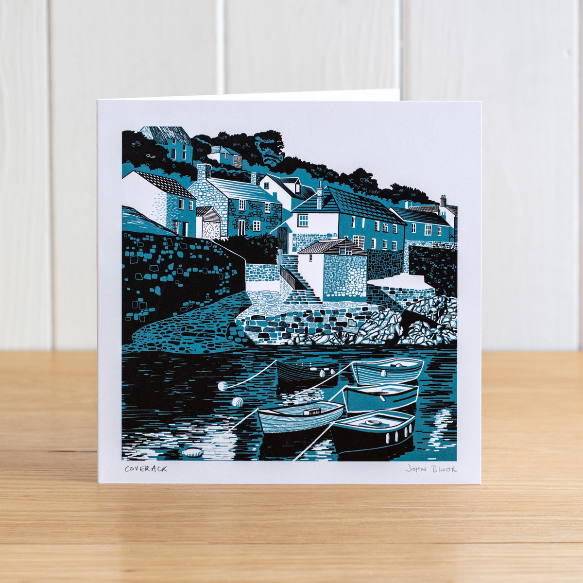 Coverack card. Based on a two colour linocut print of Coverack, Cornwall, showing the small harbour with boats, houses and slipway.&nbsp;