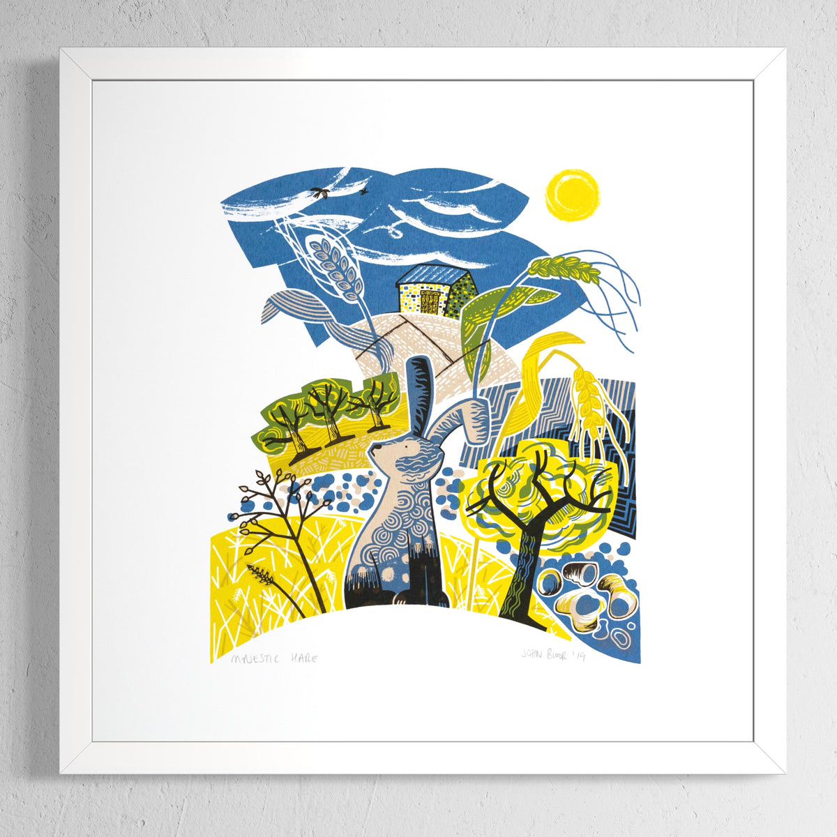 Majestic Hare screen print. It depicts a hare sitting in a yellow field with seed heads, trees, pebbles and a barn. 