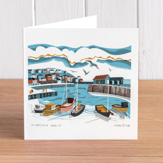 Mevagissey Harbour greetings card. It features a view of Mevagissey Harbour, Cornwall, looking out across the harbour with boats, harbour wall and houses.