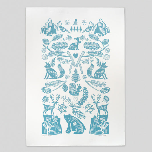 Scandi Forest screenprint in an icy blue colour and featuring many animals including bear, fox, hare, squirrel, stag and owl. It also features fir tree branches, pine cones, mountains, rocks, snowflakes and hearts. It is printed in a Scandinavian style.