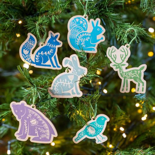 Six Scandi Forest animals hand printed on laser cut wood shapes including a fox, bear, squirrel, hare, stag and bird. In the set you will receive one of each.
