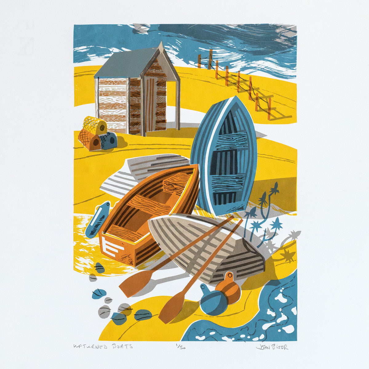 Upturned Boats screenprint, depicting four small wooden boats on a beach, some upturned, with a hut behind that, buoys and a fence. Shown on a blue wall in a living room.