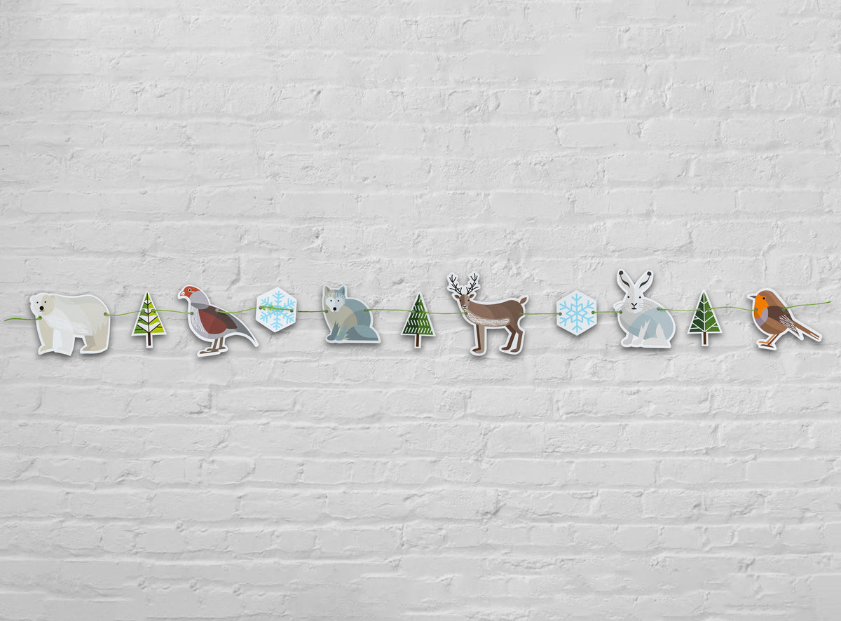 This garland is made of six Winter animals, two snowflakes and three fir trees. It features polar bear, partridge, Arctic fox, reindeer, Arctic hare and robin. 
