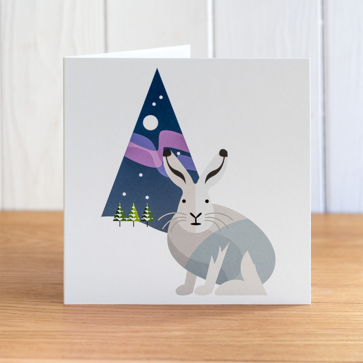 Arctic Hare Christmas card depicting an Arctic hare in front of the Northern Lights, Aurora Borealis.