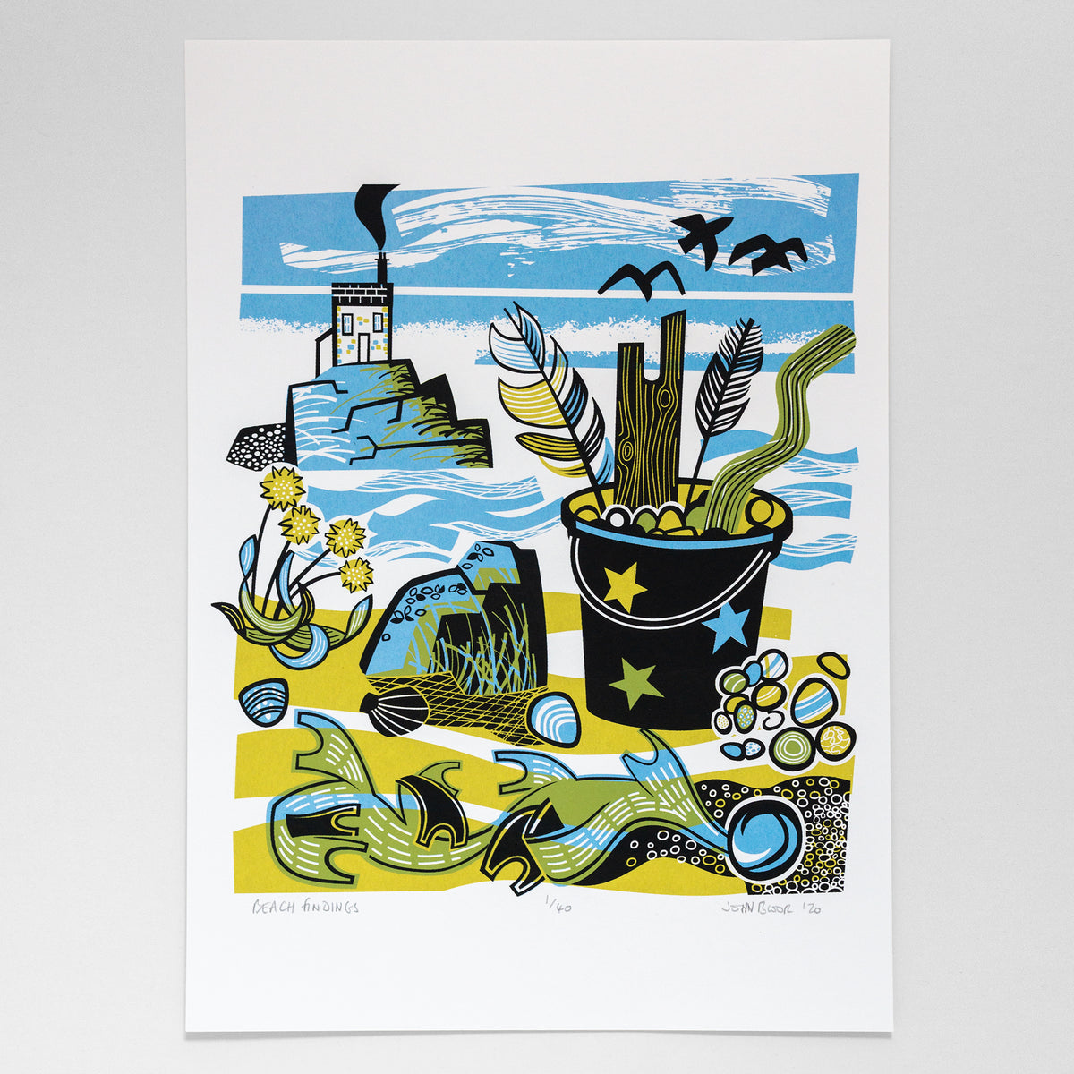 Beach Findings screenprint which depicts things I've found on a beach including a bucket with feathers, driftwood and pebbles. There is seaweed and thrift, a rock with mussels and a house on an outcrop. Inspired by all those holidays to beaches in Cornwall and Wales.