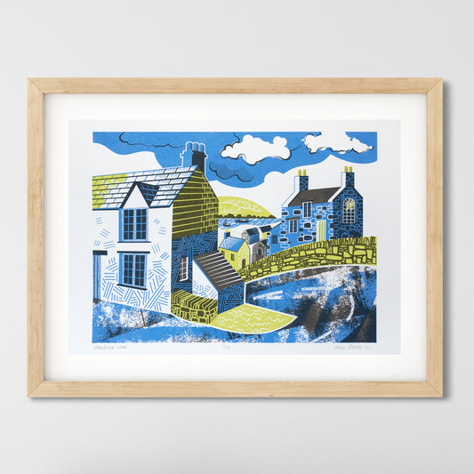 Harbour Lane screenprint. It depicts a road going down to a harbour, with houses on either side. The road turns around a corner and there's a dry stone wall. Between the houses you can see the harbour. 