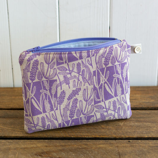 A medium size purse with hand printed lavender design.