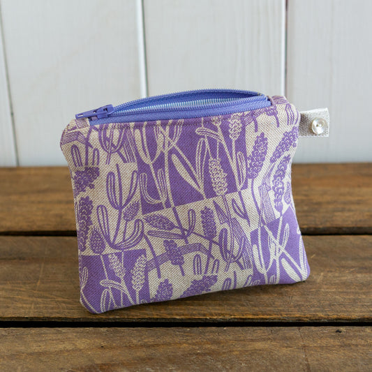 A small size purse with hand printed lavender design.