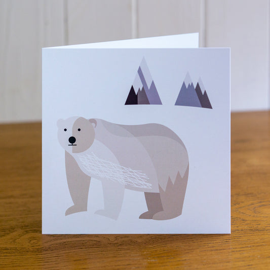 Polar Bear Christmas card depicting a polar bear standing with mountains behind.