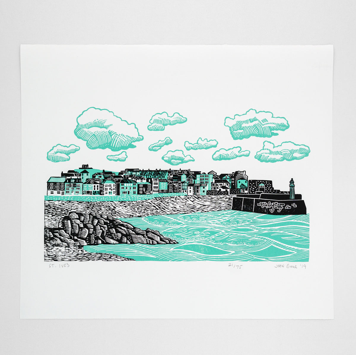St. Ives two colour linocut print in green and black. It features the harbour of St. Ives, Cornwall, with the houses looking out over the sea and beach. 