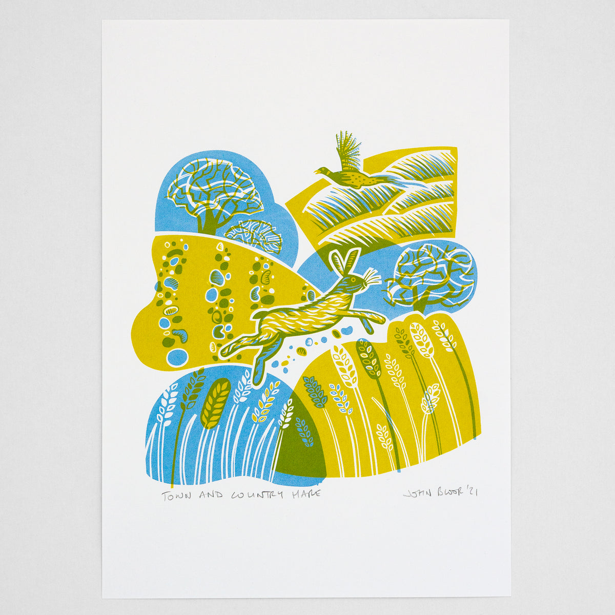 A screenprint in yellow and blue showing a hare running over fields of wheat. In the background is a pheasant.