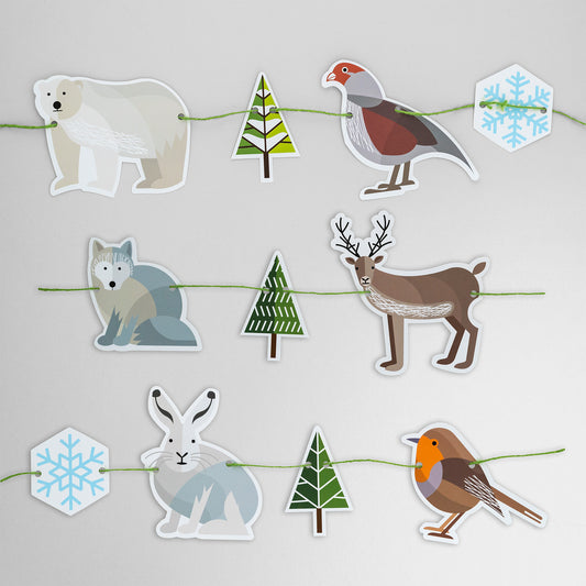 This garland is made of six Winter animals, two snowflakes and three fir trees. It features polar bear, partridge, Arctic fox, reindeer, Arctic hare and robin. 